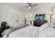 Bedroom showcasing a closet, ceiling fan, TV, and neutral decor, creating a comfortable and relaxing space at 617 N Dearborn St, Indianapolis, IN 46201