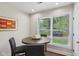 Cozy dining area features a round table with comfortable seating, perfect for intimate meals at 617 N Dearborn St, Indianapolis, IN 46201