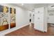 Hallway features modern art, storage, and flows into other parts of the home at 617 N Dearborn St, Indianapolis, IN 46201