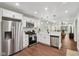 Bright kitchen features stainless steel appliances, white cabinetry, and modern pendant lighting at 617 N Dearborn St, Indianapolis, IN 46201