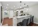 Modern kitchen features sleek white cabinets, stainless steel appliances, and a stylish breakfast bar at 617 N Dearborn St, Indianapolis, IN 46201