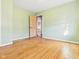 Bedroom featuring hardwood floors and a door leading to other areas at 619 Belzer Dr, Anderson, IN 46011