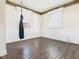 Bedroom with wood floors, wainscotting, and a hanging hammock chair at 619 Belzer Dr, Anderson, IN 46011