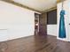 Bedroom with wood floors, wainscotting, and a hanging hammock chair at 619 Belzer Dr, Anderson, IN 46011