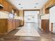 Functional kitchen featuring wooden cabinets and seamless transition to living room at 619 Belzer Dr, Anderson, IN 46011