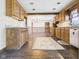 Functional kitchen featuring wooden cabinets and seamless transition to dining at 619 Belzer Dr, Anderson, IN 46011