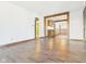 Open-concept living room featuring hardwood floors and seamless transition to kitchen and dining at 619 Belzer Dr, Anderson, IN 46011