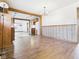 Spacious living room featuring wood-look floors and an open layout to the kitchen area at 619 Belzer Dr, Anderson, IN 46011