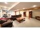 Finished basement with a sofa, chess set, elliptical, and kitchenette at 6190 Red Day Rd, Martinsville, IN 46151