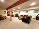 Large basement with couches, exercise equipment, television, and a kitchenette at 6190 Red Day Rd, Martinsville, IN 46151