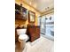 Bathroom with a wood vanity, tiled floors, medicine cabinet and walk-in shower with sliding glass doors at 6190 Red Day Rd, Martinsville, IN 46151
