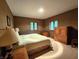 Bedroom with a queen bed, side tables with lamps and wood furniture at 6190 Red Day Rd, Martinsville, IN 46151