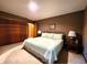 Bedroom with a queen bed, side tables with lamps, and a large closet with sliding doors at 6190 Red Day Rd, Martinsville, IN 46151