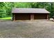 Two-car garage with gravel driveway and room for parking at 6190 Red Day Rd, Martinsville, IN 46151