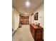 Hallway featuring carpeting, wooden cabinetry, a mini fridge and convenient access to amenities at 6190 Red Day Rd, Martinsville, IN 46151