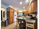 Well-lit kitchen features oak cabinets, tile floor, and breakfast bar at 6190 Red Day Rd, Martinsville, IN 46151