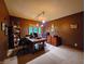 Office with a large wooden desk, chairs, and shelving, with a window providing natural light at 6190 Red Day Rd, Martinsville, IN 46151