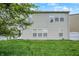 Large, grassy backyard with a white fence and two story home at 630 Harmony Way, Greenwood, IN 46143