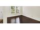 Comfortable bedroom with hardwood floors, neutral walls, and bright natural light at 630 Harmony Way, Greenwood, IN 46143