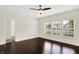 Spacious bedroom with hardwood floors, ceiling fan, and large windows providing plenty of sunlight at 630 Harmony Way, Greenwood, IN 46143