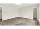 Spacious bedroom with neutral walls and carpet, featuring two entryways and bright lighting at 630 Harmony Way, Greenwood, IN 46143