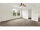 Bright bedroom with carpet flooring, ceiling fan, neutral paint, walk-in closet, and lots of light at 630 Harmony Way, Greenwood, IN 46143