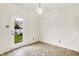 Bright dining area featuring tiled floor, backyard access, and a stylish chandelier creating a welcoming atmosphere at 630 Harmony Way, Greenwood, IN 46143