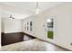 Charming dining area with hardwood floors, backyard access, and modern chandelier for an elegant touch at 630 Harmony Way, Greenwood, IN 46143