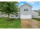 Charming two-story home with well-maintained lawn and a two car garage at 630 Harmony Way, Greenwood, IN 46143