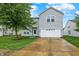 Charming two-story home with well-maintained lawn and a two car garage at 630 Harmony Way, Greenwood, IN 46143