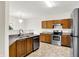 Bright kitchen featuring wood cabinets, stainless steel appliances, and elegant countertops for modern convenience at 630 Harmony Way, Greenwood, IN 46143