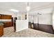 Well-appointed kitchen featuring tiled floors, wood cabinets, and modern appliances, seamlessly connected to the living area at 630 Harmony Way, Greenwood, IN 46143