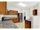 Kitchen with stainless steel appliances, stone countertops and access to the laundry room at 630 Harmony Way, Greenwood, IN 46143