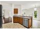 Kitchen featuring stainless steel dishwasher and sink plus access to a fenced backyard at 630 Harmony Way, Greenwood, IN 46143