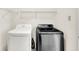 Bright laundry room features side by side washer and dryer at 630 Harmony Way, Greenwood, IN 46143