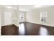 Bright living room with hardwood floors, white walls and natural light at 630 Harmony Way, Greenwood, IN 46143