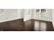 Inviting living room with hardwood floors, neutral walls, and bright, natural light at 630 Harmony Way, Greenwood, IN 46143