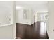 Open concept living space featuring hardwood floors, white walls, and natural light at 630 Harmony Way, Greenwood, IN 46143