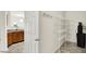 Pantry area off kitchen with wire shelving and a water treatment system at 630 Harmony Way, Greenwood, IN 46143