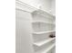 Customizable pantry shelving provides plenty of storage space in the pantry at 630 Harmony Way, Greenwood, IN 46143