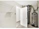Utility room with shelving, hot water heater, and storage space at 630 Harmony Way, Greenwood, IN 46143