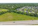 Aerial view of a development with homes, landscaping, and easy access to nearby roadways at 644 Ridge Gate Dr, Brownsburg, IN 46112