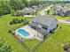 Aerial view of a well-maintained home with an expansive lawn and lush greenery at 644 Ridge Gate Dr, Brownsburg, IN 46112