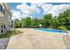 Expansive backyard with a pool, patio, and lush greenery, perfect for outdoor activities and relaxation at 644 Ridge Gate Dr, Brownsburg, IN 46112
