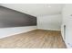Unfinished basement featuring gray accent wall, neutral paint, light wood-look floors and recessed lighting at 644 Ridge Gate Dr, Brownsburg, IN 46112