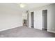Bedroom featuring neutral carpet and paint plus a closet with sliding doors and ceiling fan at 644 Ridge Gate Dr, Brownsburg, IN 46112