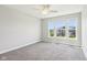 Bedroom featuring neutral carpet and paint plus a large window overlooking the neighborhood at 644 Ridge Gate Dr, Brownsburg, IN 46112