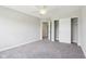 Bedroom featuring neutral paint, carpeted floors, ceiling fan and closet with sliding doors at 644 Ridge Gate Dr, Brownsburg, IN 46112