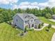 Aerial view of a beautifully landscaped home with a manicured lawn and mature trees at 644 Ridge Gate Dr, Brownsburg, IN 46112