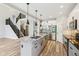 Well-designed kitchen with granite island, stainless steel appliances, and open access to the living room at 644 Ridge Gate Dr, Brownsburg, IN 46112